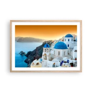 Poszter világos tölgy keretben - Santorini – rásimulva a sziklákra - 70x50 cm