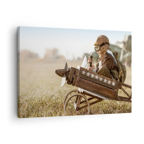 Vászonkép - Egy gyerek egy játékrepülőgépen, a háttérben egy mezővel - 70x50cm - Indulás egy álom felé - Modern fali dekoráció nappalihoz és hálószobához ARTTOR