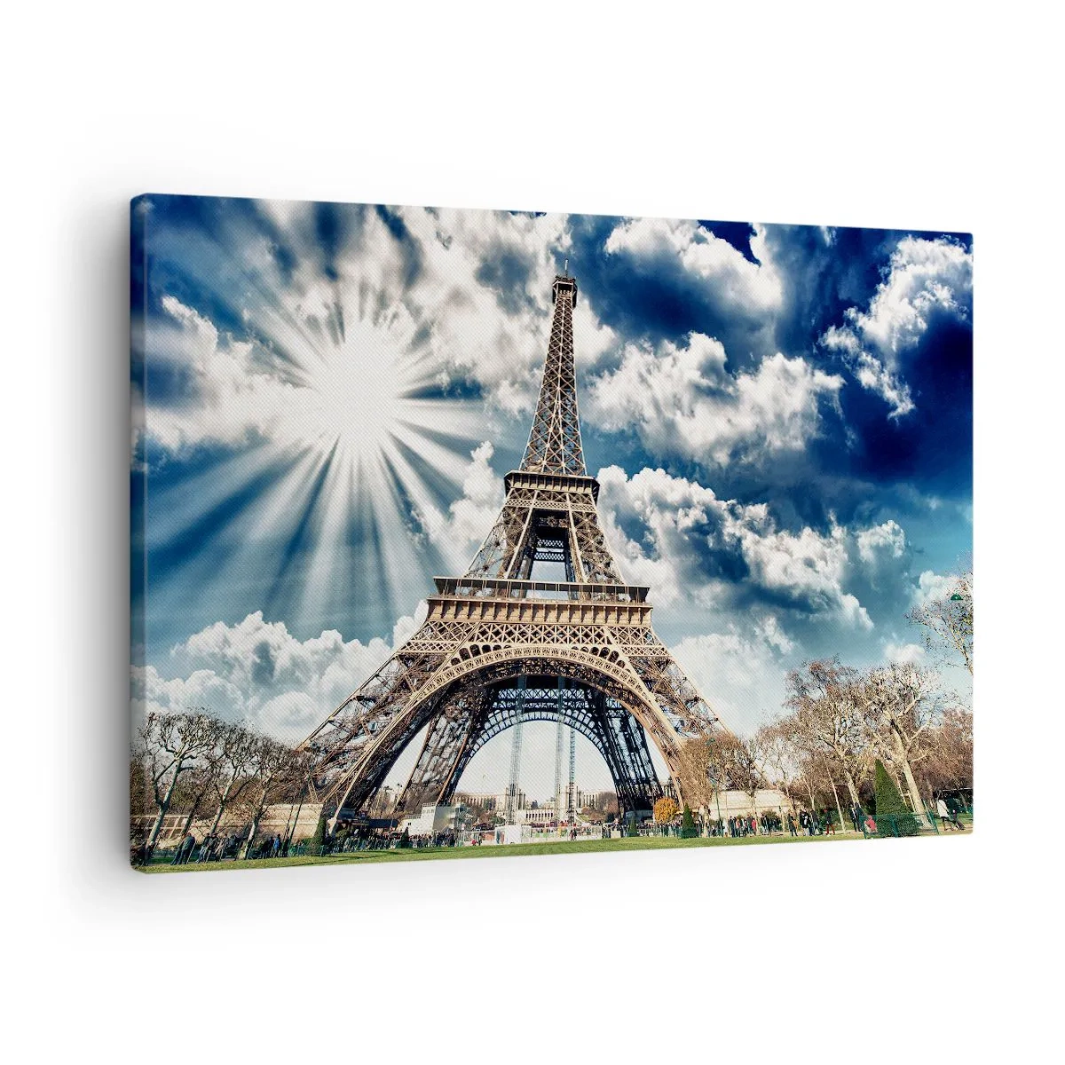 Vászonkép - Az Eiffel-torony napsütéses égbolton, felhők között - 70x50cm - Az egyetlen ilyen a nap alatt - Modern fali dekoráció nappalihoz és hálószobához ARTTOR