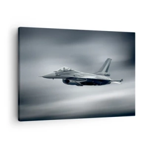 Vászonkép - Egy vadászgép repülés közben felhős égbolton - 70x50cm - Kihívod? - Modern fali dekoráció nappalihoz és hálószobához ARTTOR