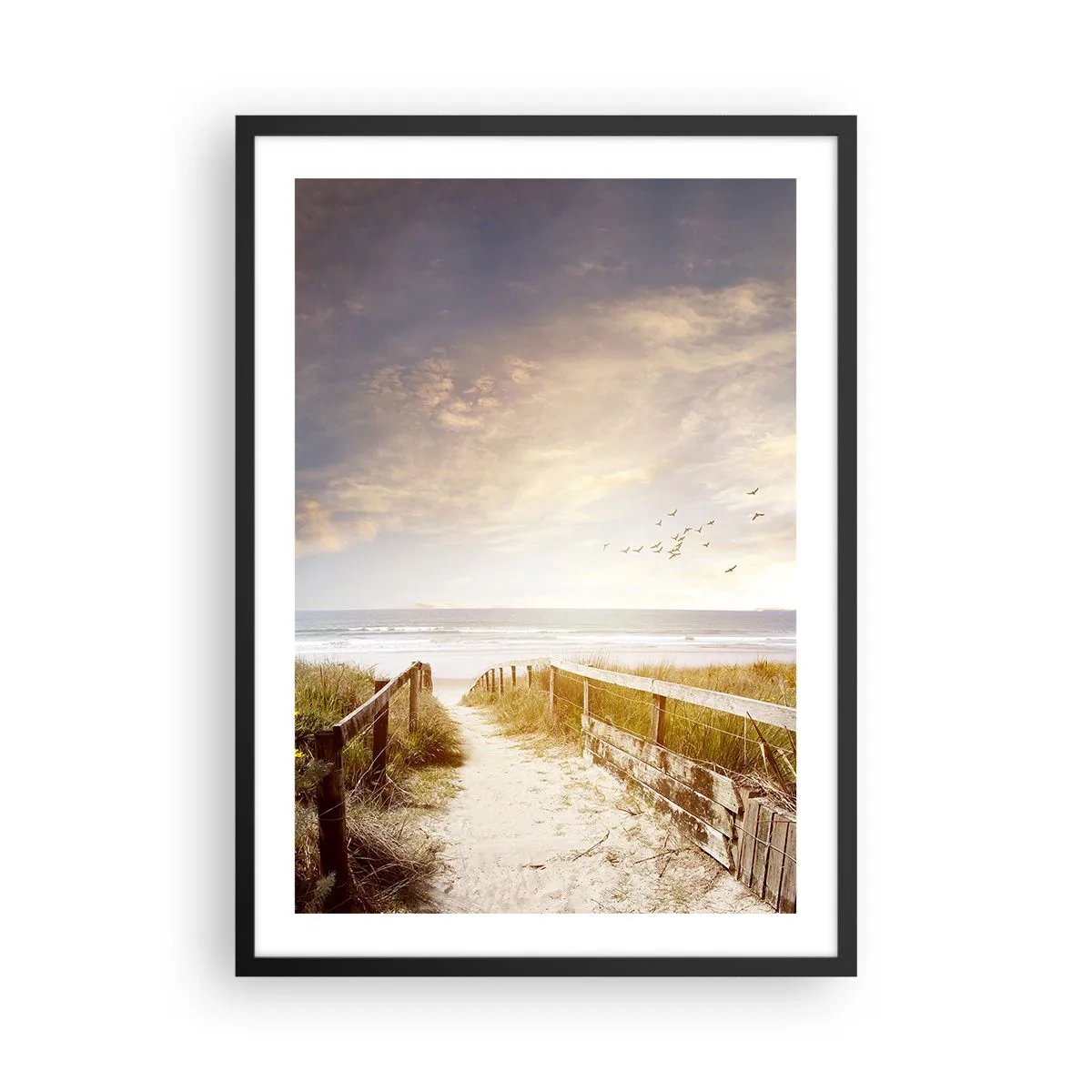 Poszter fehér keretben - Ösvény a tengerpartra naplementekor, madarak repülnek el mellettünk - 50x70cm - A béke tere - Modern fali dekoráció nappalihoz és hálószobához ARTTOR
