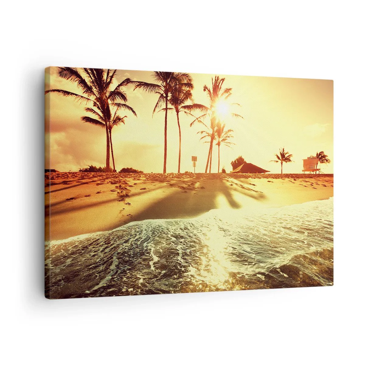 Vászonkép - Egy pálmafákkal teli strand, amelyet meleg naplemente világít meg - 70x50cm - Kaliforniai délután - Modern fali dekoráció nappalihoz és hálószobához ARTTOR
