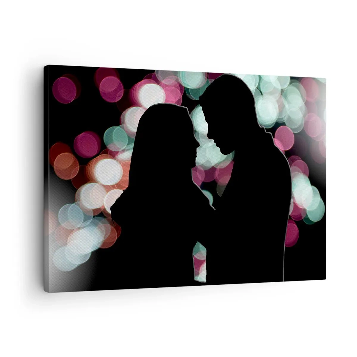 Vászonkép - Egy pár sziluettjei színes bokeh fények hátterében - 70x50cm - Igen! - Modern fali dekoráció nappalihoz és hálószobához ARTTOR