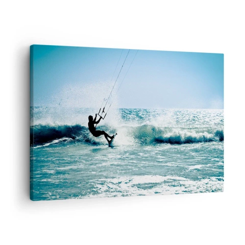 Vászonkép - Kitesurfer lovagol egy hullámot teljes napsütésben - 70x50cm - Ragadtasd el magadat - Modern fali dekoráció nappalihoz és hálószobához ARTTOR