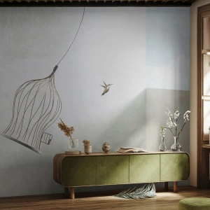 Fotótapéta Standard Eco - Egy kolibri repülés közben, nyitott kalitkával az ég ellen - 100x70cm - Az elememen - Modern fali dekoráció nappalihoz és hálószobához ARTTOR