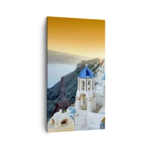 Vászonkép - Santorini – rásimulva a sziklákra - 45x80 cm
