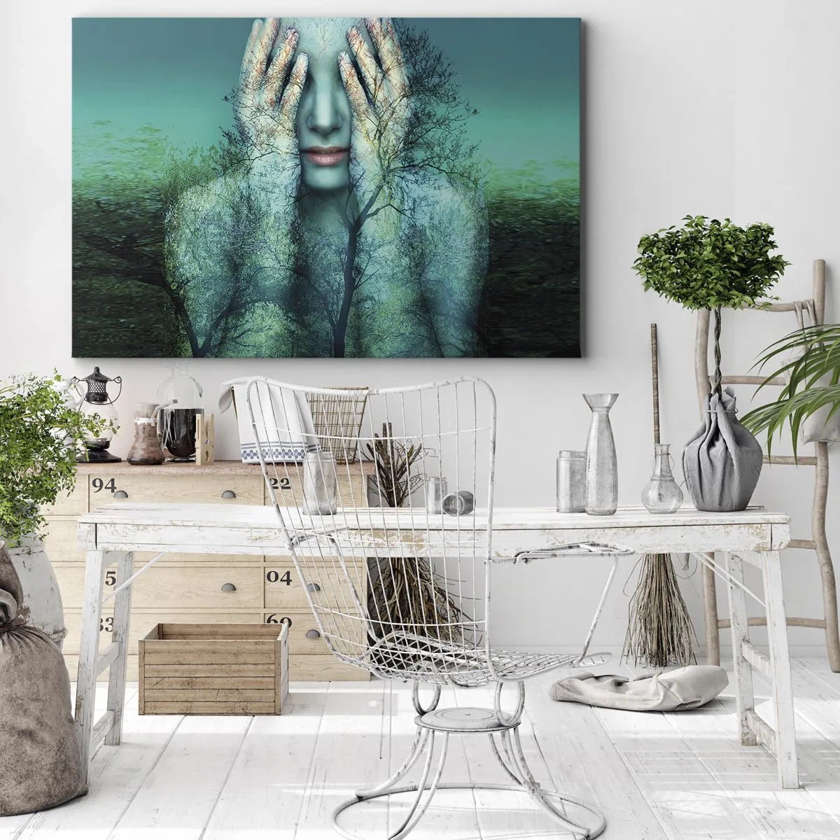 Vászonkép - Egy nőalak fa motívummal türkizkék tájkép hátterében - 70x50cm - Kékbe merítve - Modern fali dekoráció nappalihoz és hálószobához ARTTOR