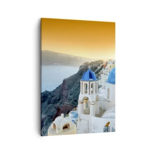 Vászonkép - Santorini – rásimulva a sziklákra - 50x70 cm