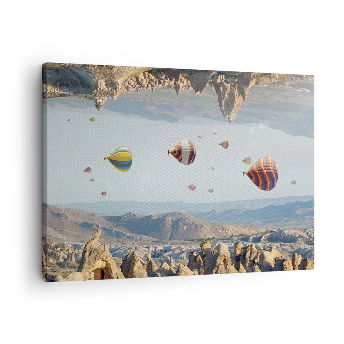 Vászonkép - Színes léggömbök egy sziklás táj felett - 70x50cm - Itt minden lehetséges - Modern fali dekoráció nappalihoz és hálószobához ARTTOR