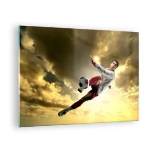 Üveg kép - Egy futballista akcióban az aranyló égbolton - 70x50cm - Futball Mennyország - Modern fali dekoráció nappalihoz és hálószobához ARTTOR
