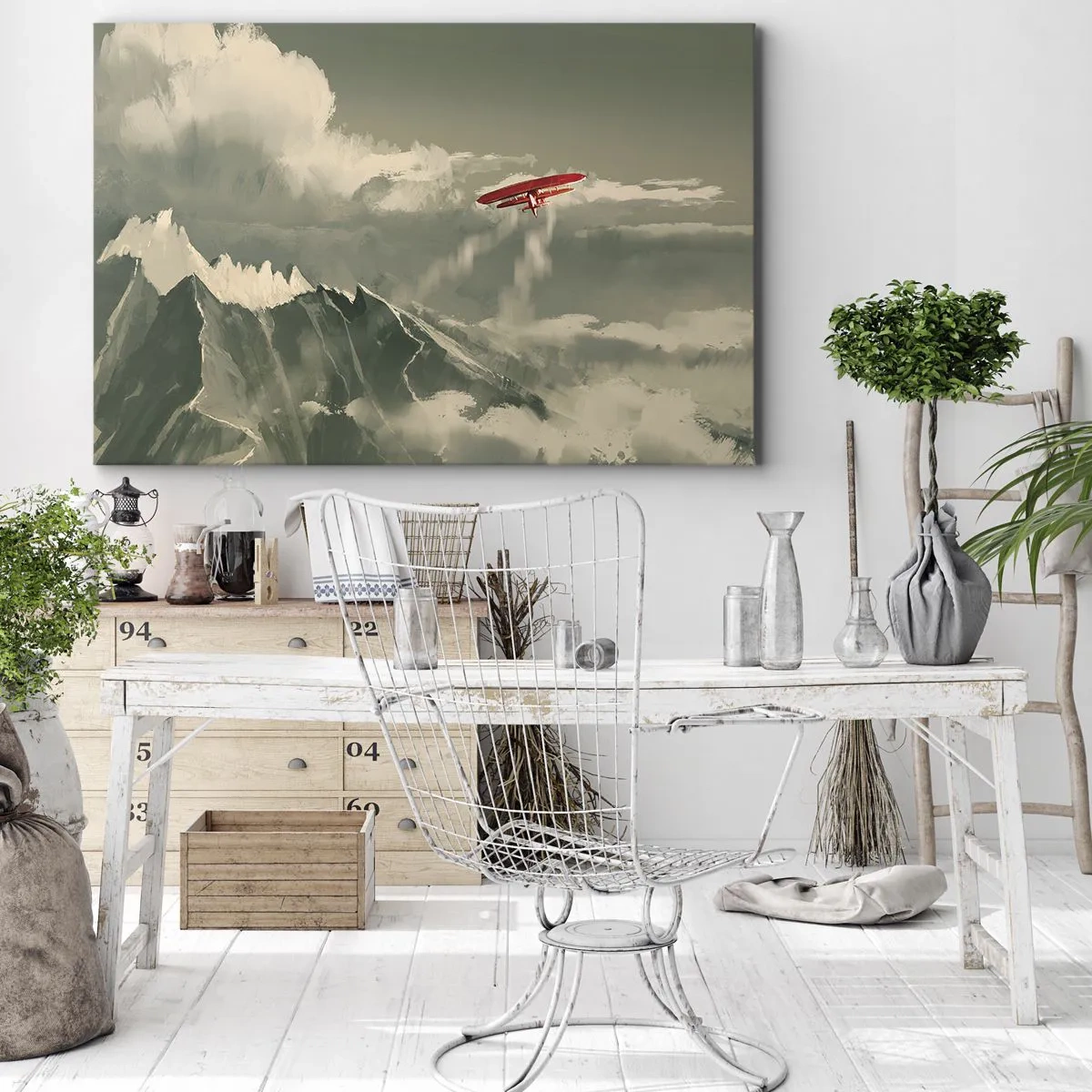 Vászonkép - Piros repülőgép hófödte hegyek felett - 70x50cm - Rettenthetetlen úttörő - Modern fali dekoráció nappalihoz és hálószobához ARTTOR