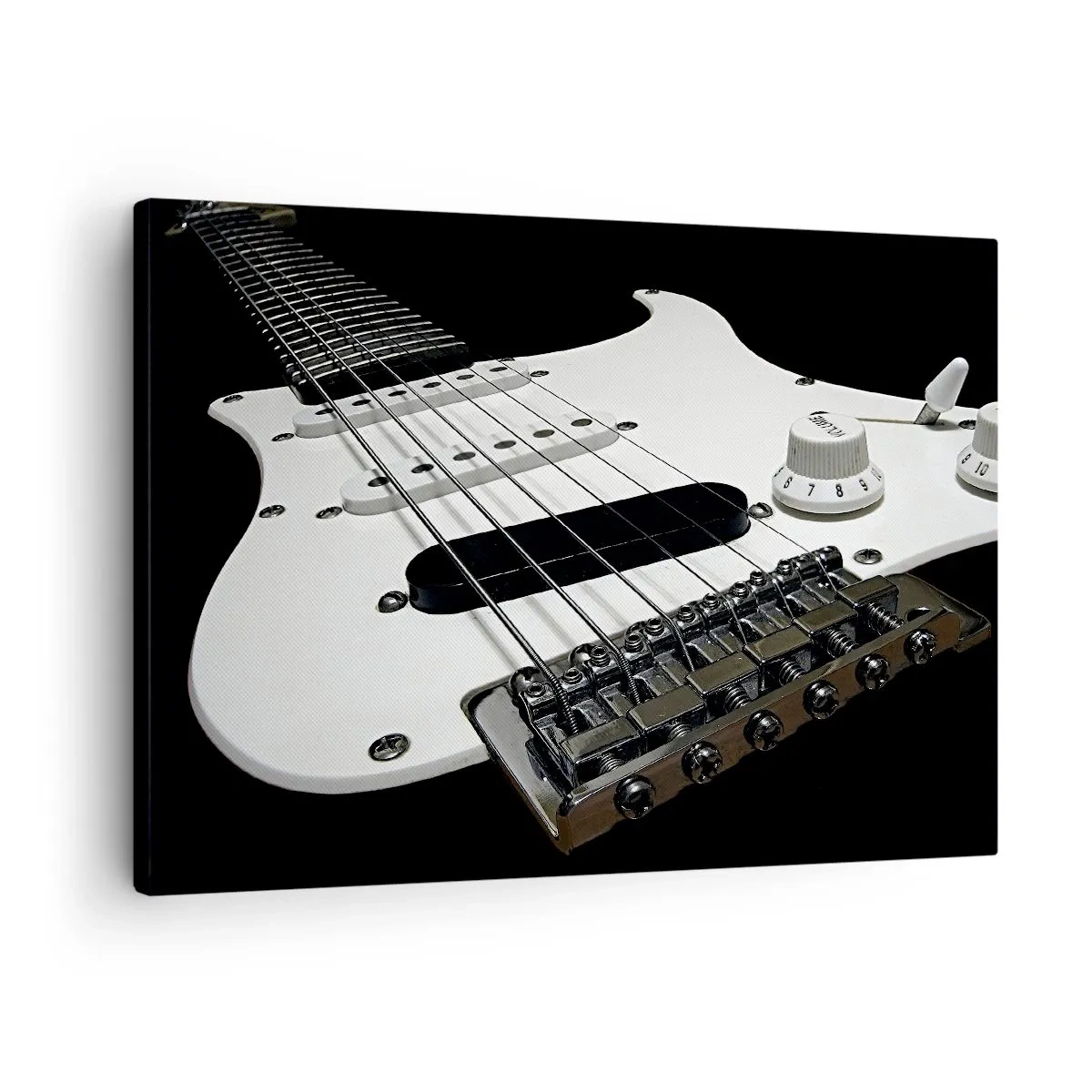 Vászonkép - Közeli kép: egy fehér elektromos gitár fekete háttér előtt. - 70x50cm - Fehérbe rejtett hang - Modern fali dekoráció nappalihoz és hálószobához ARTTOR