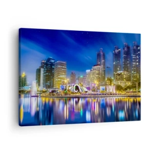 Vászonkép - Éjszakai panoráma a városról, a vízen tükröződő fényekkel - 70x50cm - Metropolis szivárvány éjszakája - Modern fali dekoráció nappalihoz és hálószobához ARTTOR