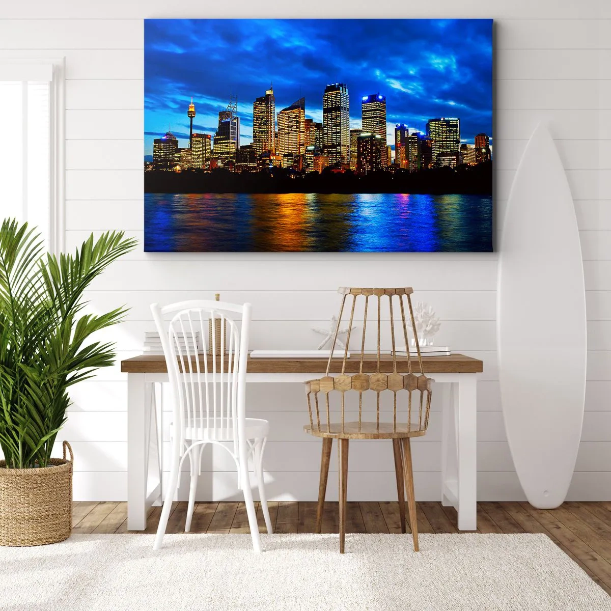 Vászonkép - Az éjszakai város panorámája kivilágított felhőkarcolókkal a víz felett - 70x50cm - Fények és színek éjszakája - Modern fali dekoráció nappalihoz és hálószobához ARTTOR
