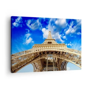 Vászonkép - Az Eiffel-torony alulról a kék ég hátterében - 70x50cm - Az ég és a felhők felé nyúlva - Modern fali dekoráció nappalihoz és hálószobához ARTTOR
