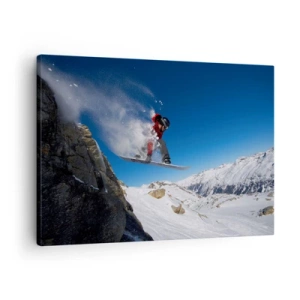 Vászonkép - Egy snowboardos leugrik egy szikláról egy hegyvidéki táj hátterében. - 70x50cm - És a tér részévé váltál - Modern fali dekoráció nappalihoz és hálószobához ARTTOR