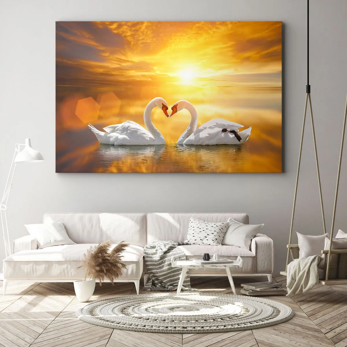 Vászonkép - Romantikus jelenet két hattyúról, amint szívet formálnak egy aranyló naplemente hátterében. - 70x50cm - A szív a legszebb szó a világon... - Modern fali dekoráció nappalihoz és hálószobához ARTTOR