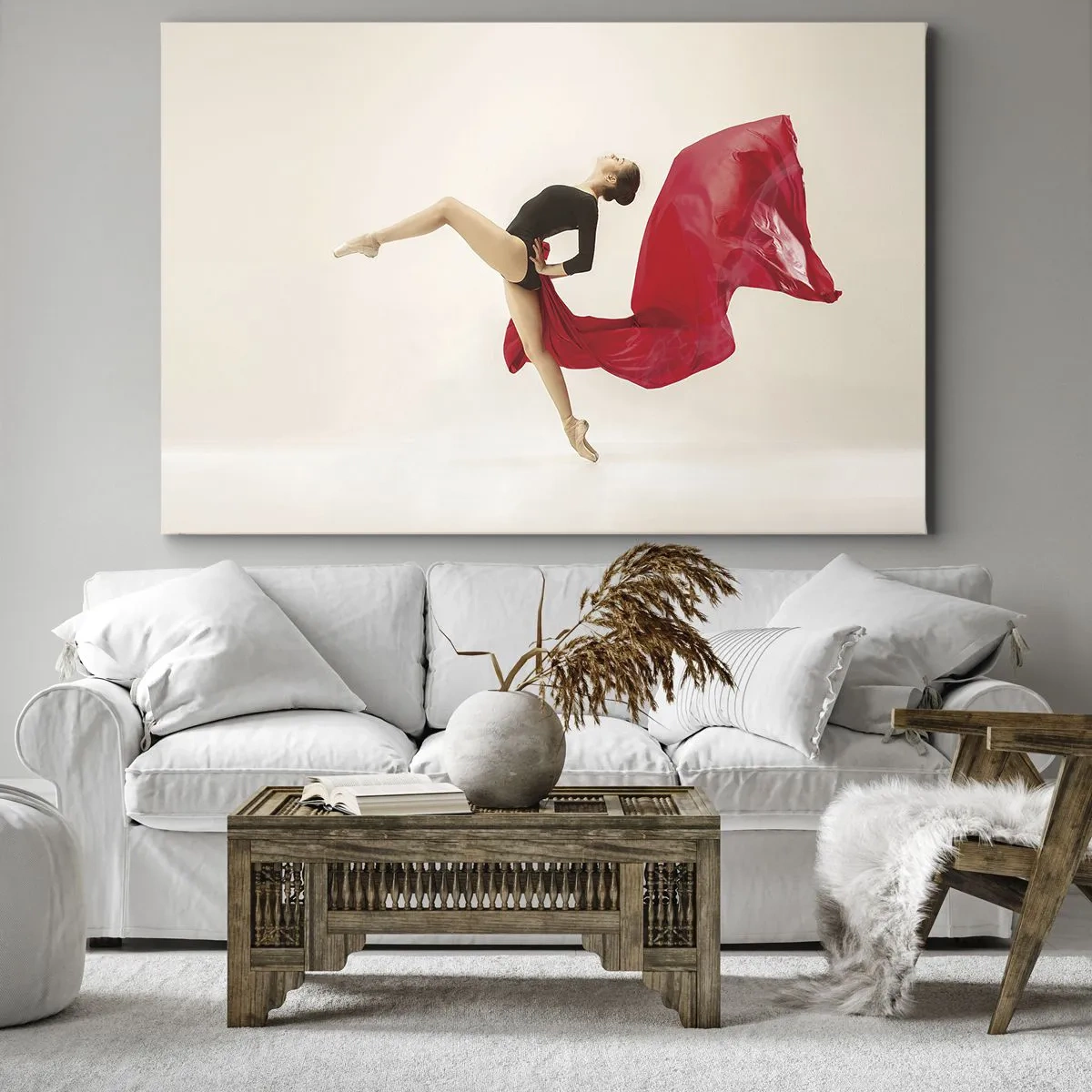 Vászonkép - Egy dinamikus táncos fekete ruhában és piros anyagban mozgásban. - 70x50cm - Piros és fekete - Modern fali dekoráció nappalihoz és hálószobához ARTTOR