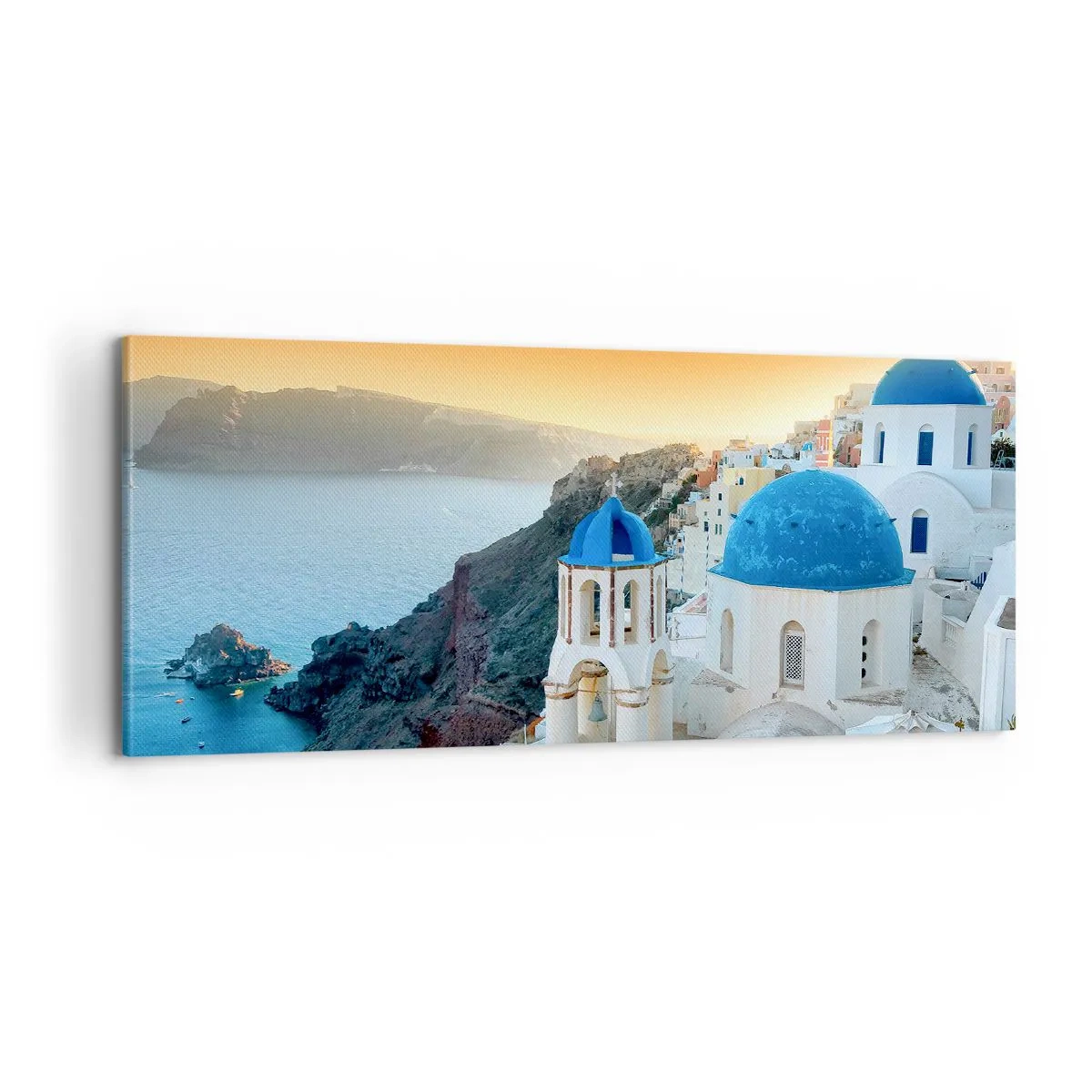 Vászonkép - Santorini – rásimulva a sziklákra - 100x40 cm