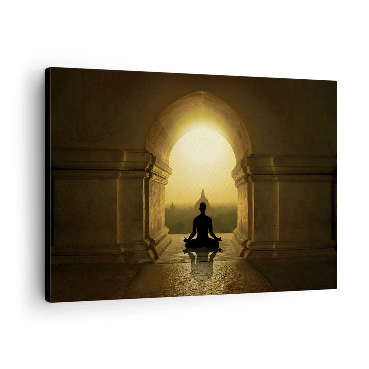 Vászonkép - Meditáló személy sziluettje a lenyugvó nap fényében - 70x50cm - Teljes harmónia - Modern fali dekoráció nappalihoz és hálószobához ARTTOR