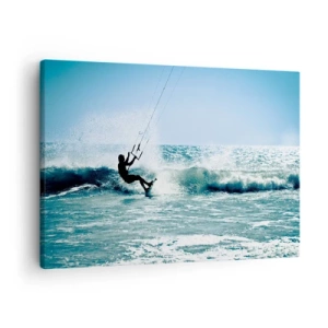 Vászonkép - Kitesurfer lovagol egy hullámot teljes napsütésben - 70x50cm - Ragadtasd el magadat - Modern fali dekoráció nappalihoz és hálószobához ARTTOR