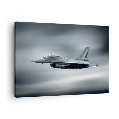 Vászonkép - Egy vadászgép repülés közben felhős égbolton - 70x50cm - Kihívod? - Modern fali dekoráció nappalihoz és hálószobához ARTTOR