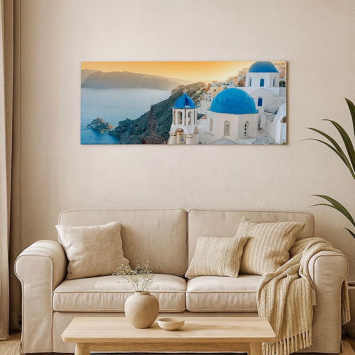 Vászonkép - Santorini – rásimulva a sziklákra - 100x40 cm