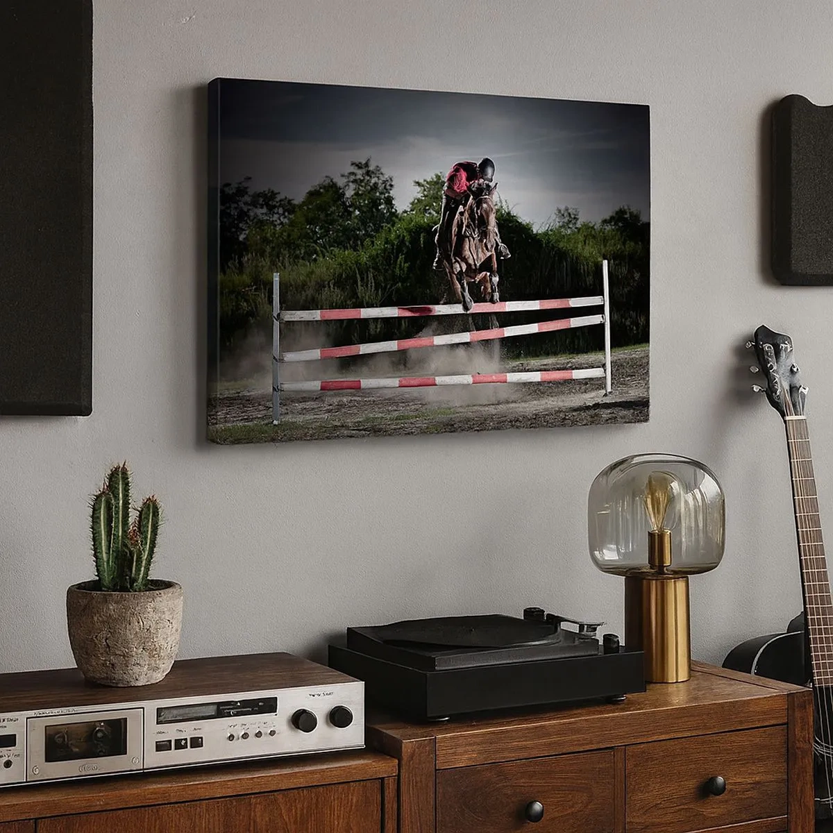 Vászonkép - Egy lovas ugrik át egy akadályon a versenypályán - 70x50cm - Együtt a győzelemért - Modern fali dekoráció nappalihoz és hálószobához ARTTOR