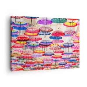 Vászonkép - Színes esernyők lebegnek a levegőben - 70x50cm - Városi rét - Modern fali dekoráció nappalihoz és hálószobához ARTTOR