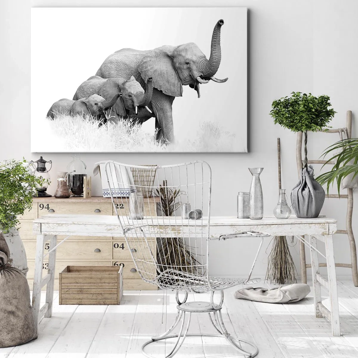 Vászonkép - Egy elefántcsalád egy afrikai táj előtt fekete-fehérben. - 70x50cm - Egy, kettő, három - Modern fali dekoráció nappalihoz és hálószobához ARTTOR