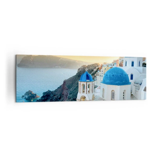 Vászonkép - Santorini – rásimulva a sziklákra - 160x50 cm