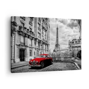 Vászonkép - Egy piros autó, a háttérben az Eiffel-torony fekete-fehér környezetben - 70x50cm - Ragadozó a városban - Modern fali dekoráció nappalihoz és hálószobához ARTTOR