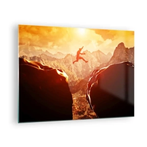 Üveg kép - Ugrás egy szakadék felett hegyi tájban naplementekor - 70x50cm - Átlépve a határokat - Modern fali dekoráció nappalihoz és hálószobához ARTTOR