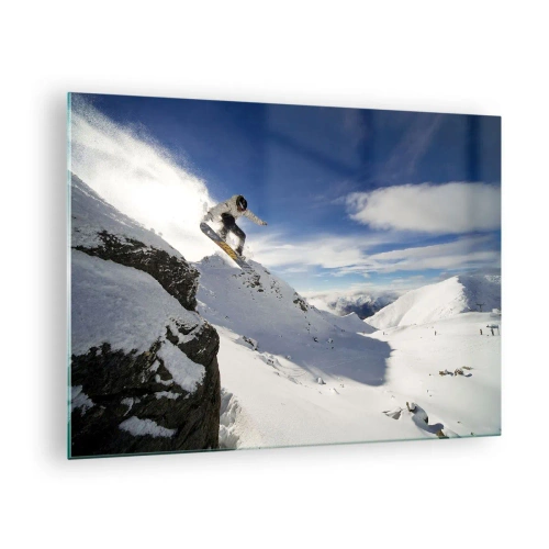 Üveg kép - Egy snowboardos leugrik egy szikláról a hegyekben télen - 70x50cm - Szabadság határok nélkül - Modern fali dekoráció nappalihoz és hálószobához ARTTOR