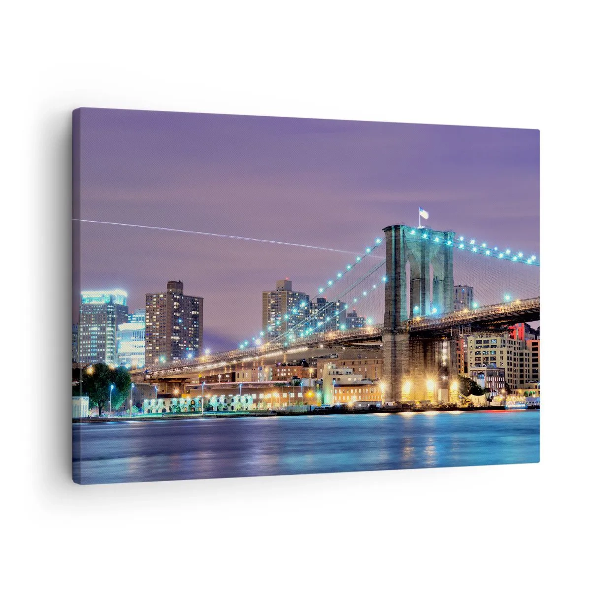 Vászonkép - Brooklyn híd éjszaka, a háttérben a kivilágított várossal - 70x50cm - Sok éve a Brooklyn-i Híd - Modern fali dekoráció nappalihoz és hálószobához ARTTOR