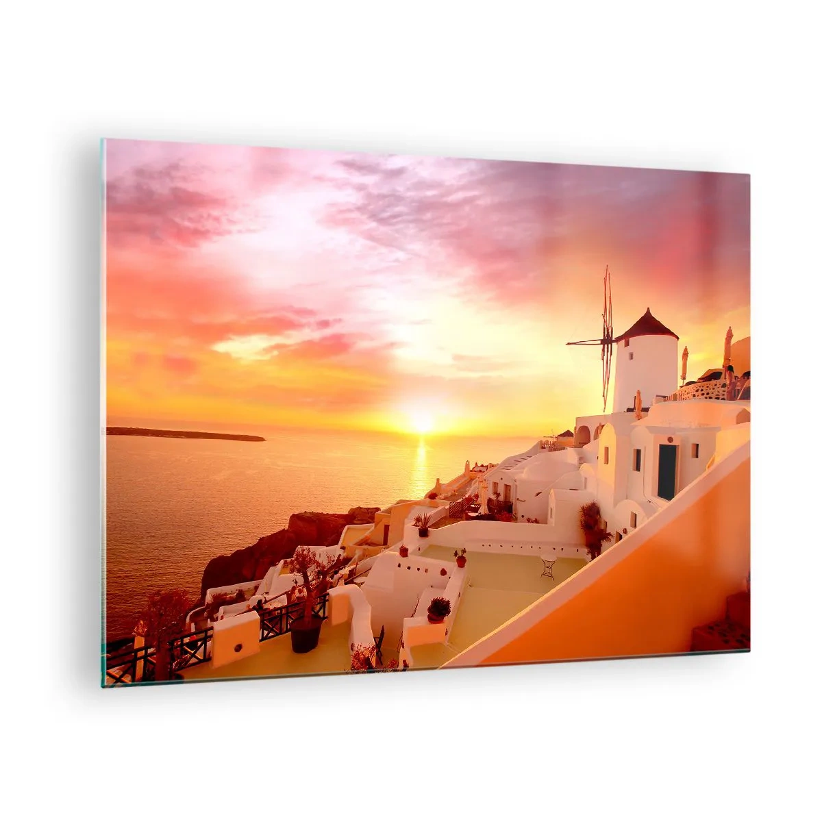 Üveg kép - Naplemente Santorini felett fehér épületekkel és egy szélmalommal - 70x50cm - Szétfolyni a fehérben és aranyban - Modern fali dekoráció nappalihoz és hálószobához ARTTOR