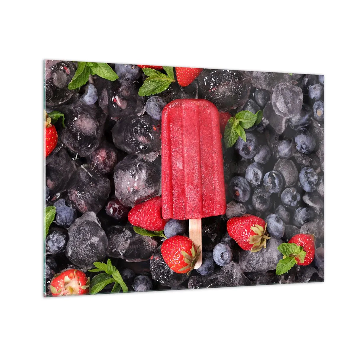 Üveg kép - Egy jégkrémpálcika fagyasztott gyümölcsök és mentalevelek között - 70x50cm - A forró nyár íze - Modern fali dekoráció nappalihoz és hálószobához ARTTOR