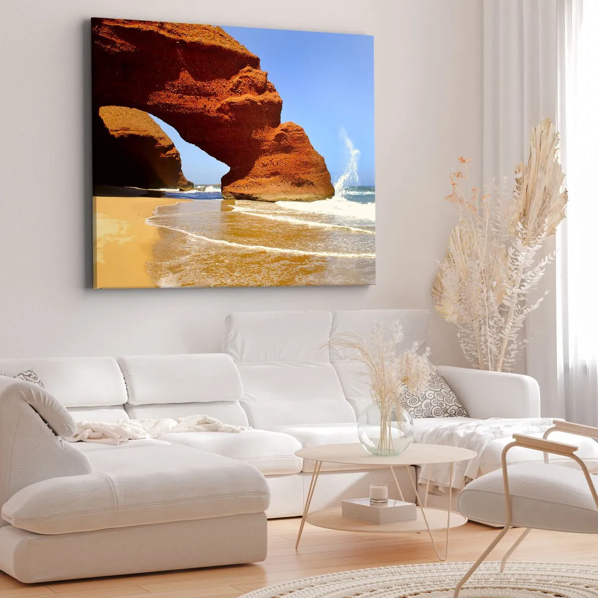 Vászonkép - Természetes sziklaív a tengerparton, kék éggel és hullámokkal - 70x50cm - Víz és szél évezredek óta - Modern fali dekoráció nappalihoz és hálószobához ARTTOR