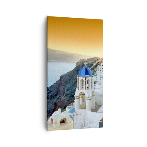 Vászonkép - Santorini – rásimulva a sziklákra - 55x100 cm