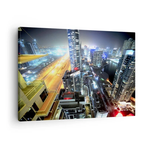 Vászonkép - Az éjszakai város panorámája kivilágított felhőkarcolókkal - 70x50cm - Csoda a sivatagban - Modern fali dekoráció nappalihoz és hálószobához ARTTOR
